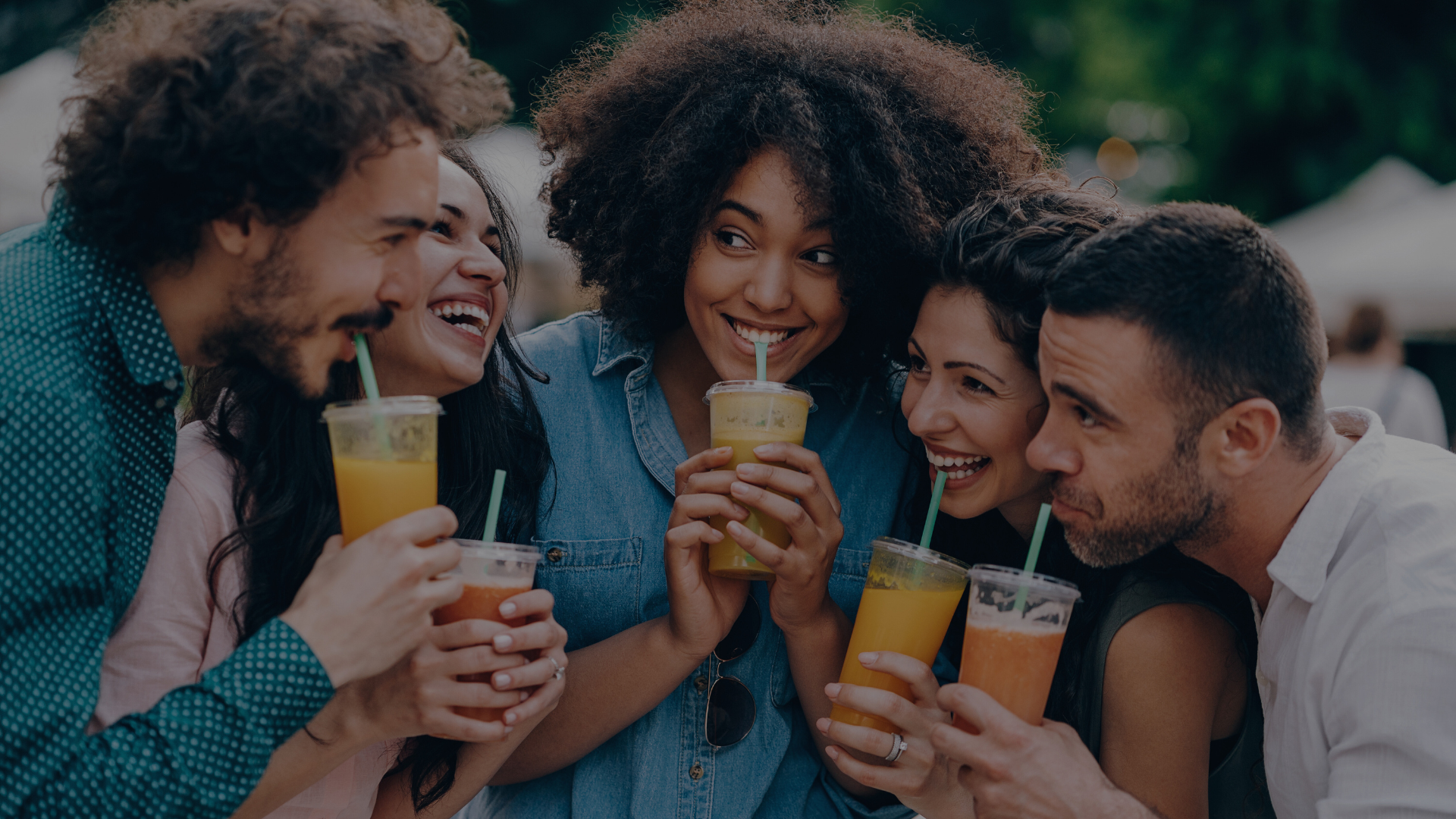 “Group of friends smiling and enjoying fresh smoothies together – Afyalishe contact page hero image